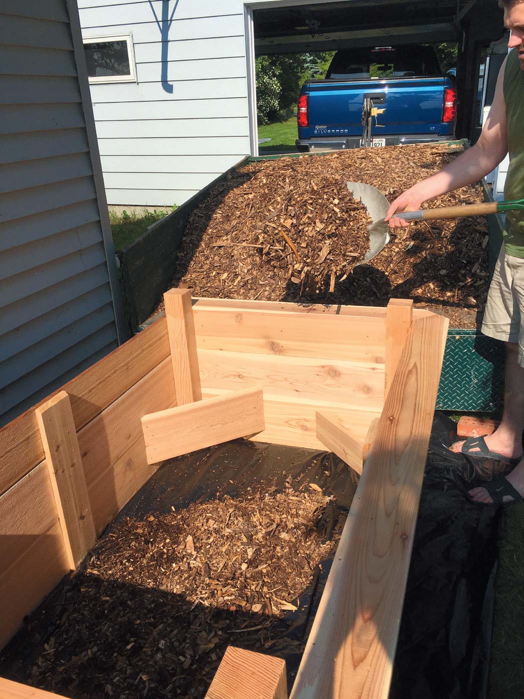 To fill the beds, we used a 3:1 ratio of about one and a half yards of mulch to clean fill dirt.