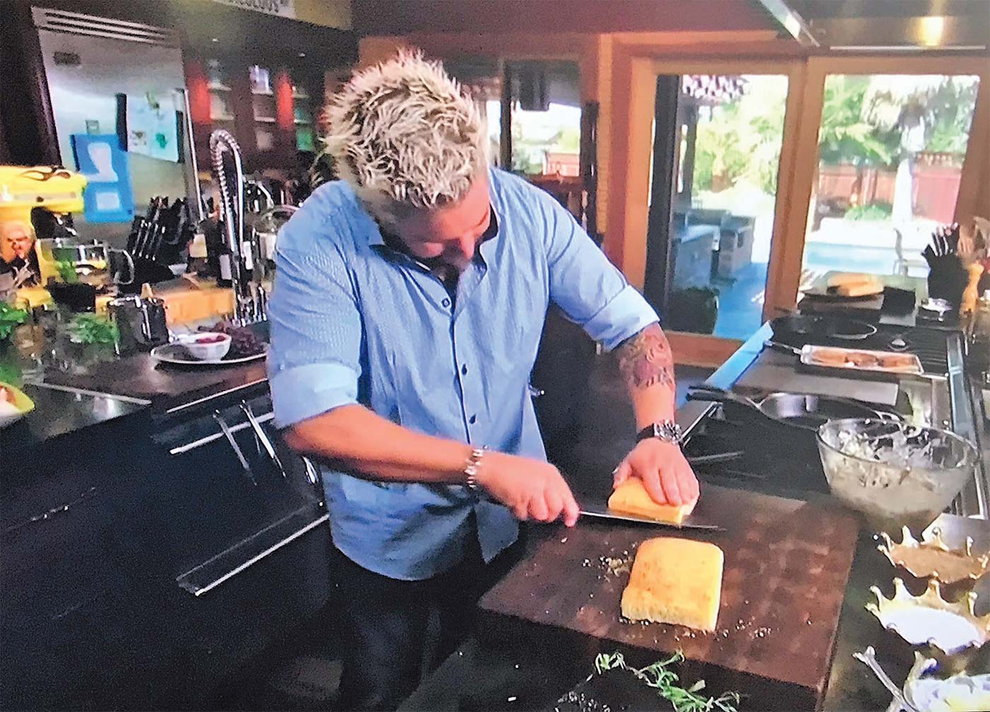 Food Network celebrity chef Guy Fieri working on a Richard Rose cutting board. Contributed board